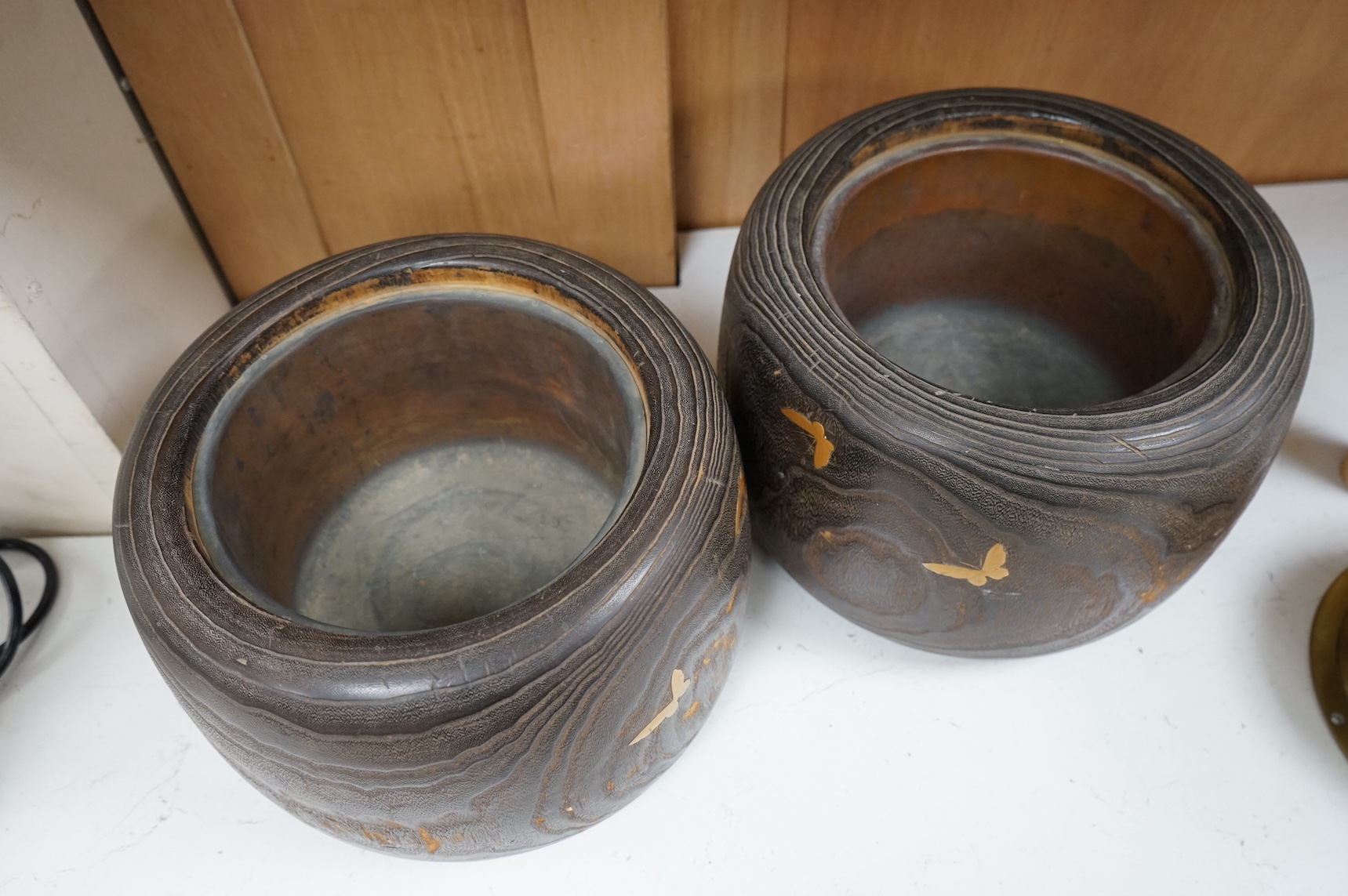A pair of Japanese hibachi bowls with lacquered decoration and abalone inlay, label to the bases, 29cm in diameter. Condition - fair, some inlay missing
